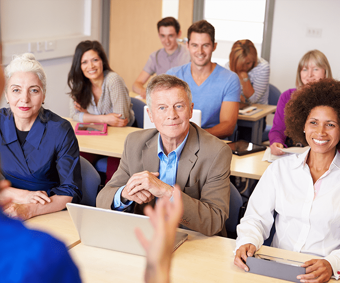 Classroom of people looking at instructor